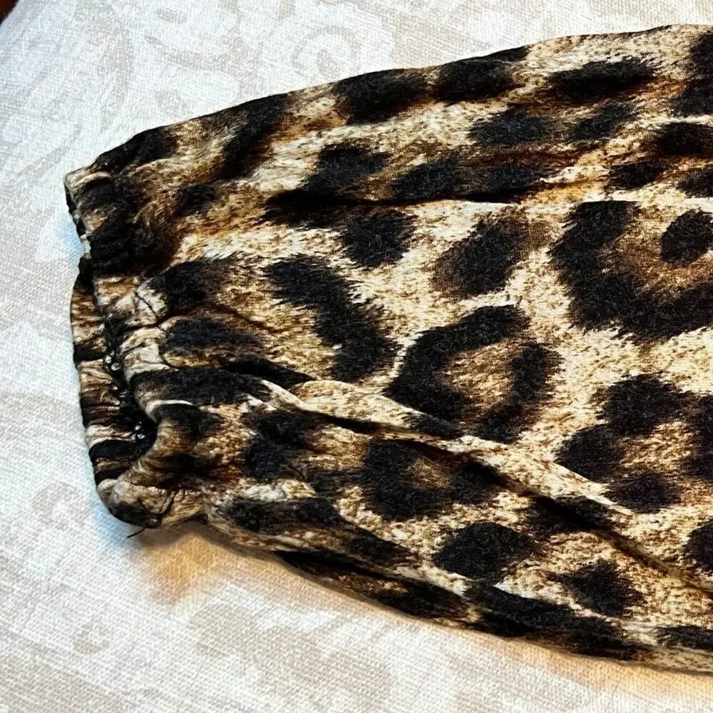 Michael Kors animal print 3/4 sleeve top with elastic hem  Size M